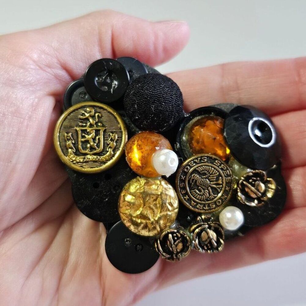 Black button heart shaped brooch